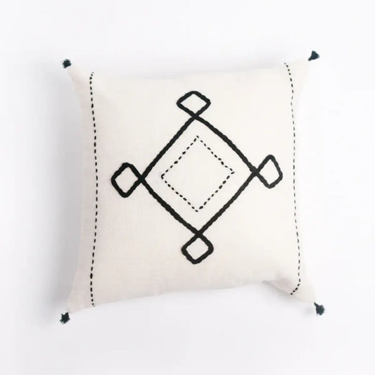 embroidered-pillows-on-bed