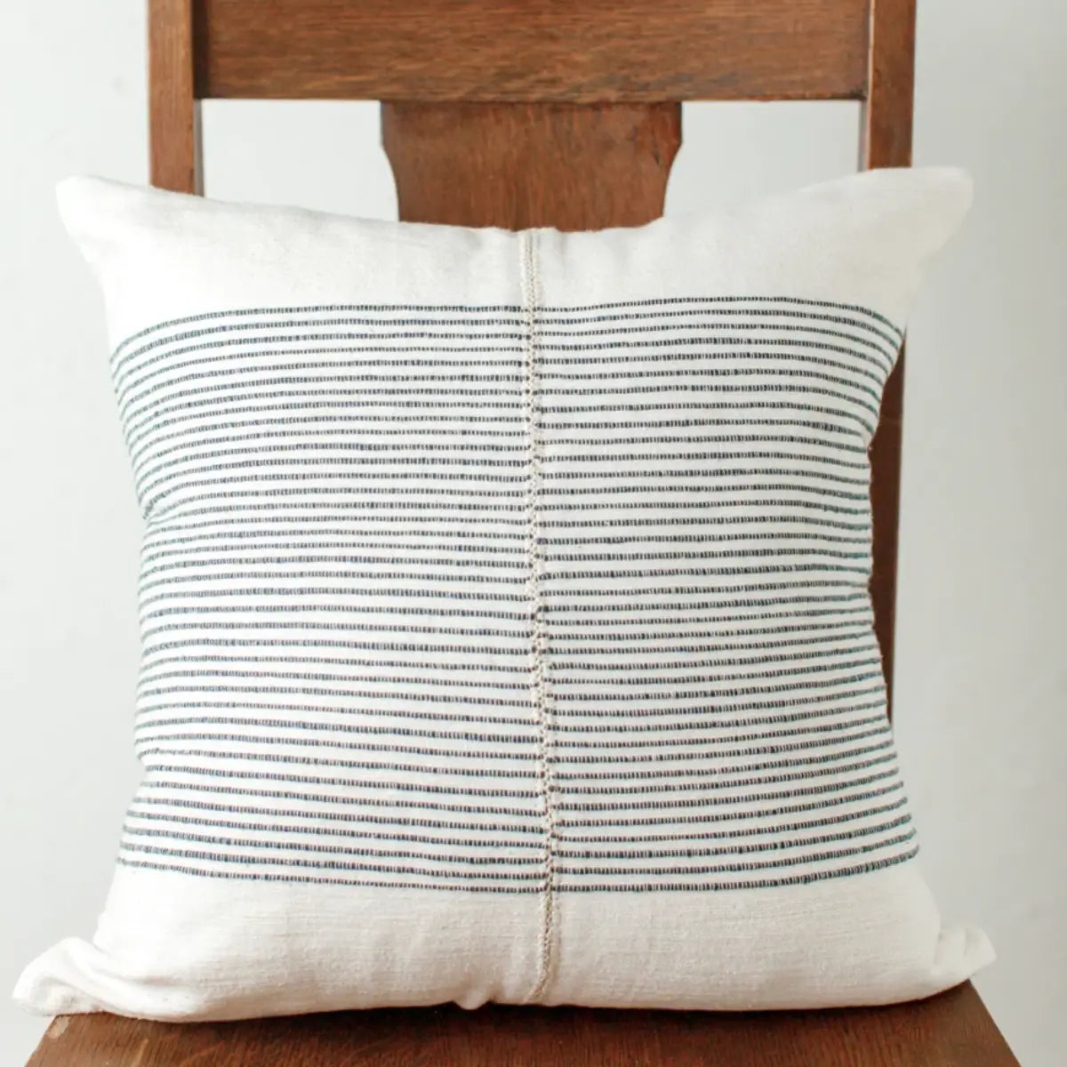 navy-riviera-pillow-cover-on-chair