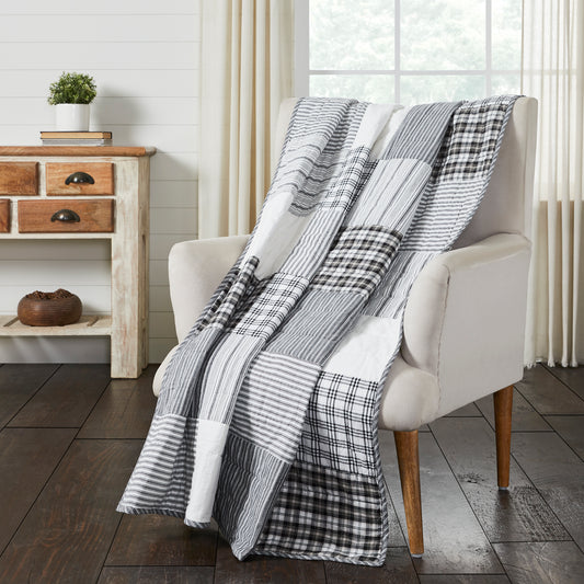 Sawyer Black Quilted Blanket on chair