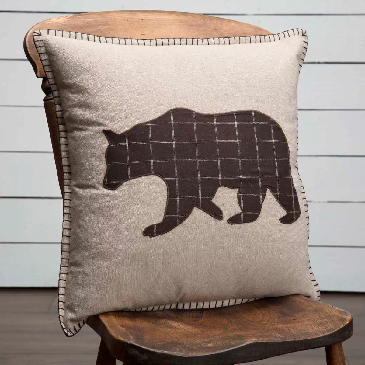 bear applique cushion on chair