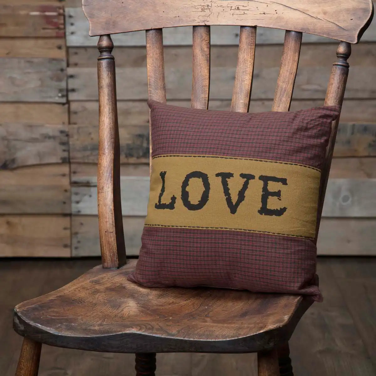 love pillow on chair wood background